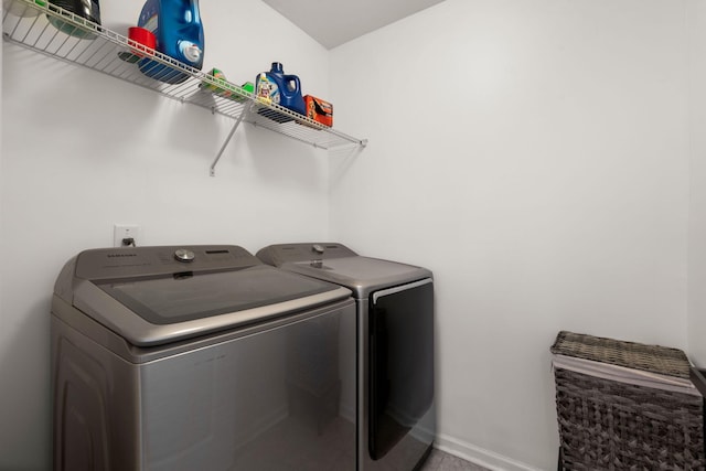 laundry area with separate washer and dryer