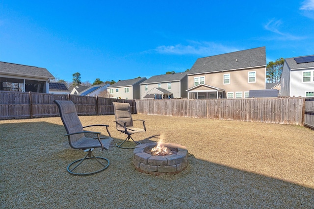 view of yard with a fire pit