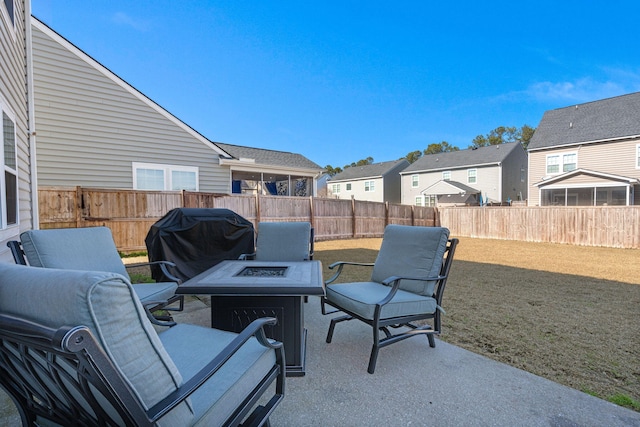 view of patio / terrace with area for grilling and a fire pit