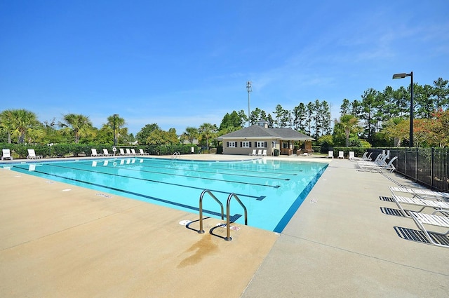 view of swimming pool with a patio area