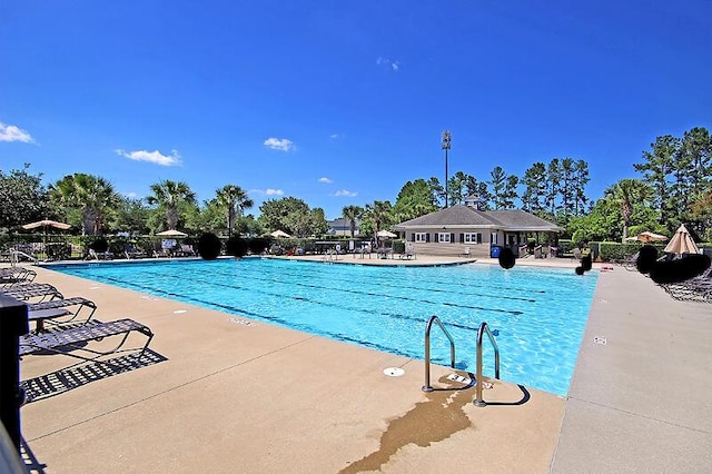 view of swimming pool featuring a patio area