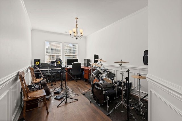 office area with hardwood / wood-style flooring, crown molding, and a notable chandelier