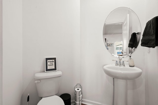 bathroom featuring sink and toilet