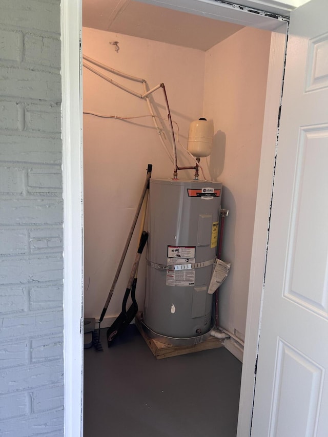utility room featuring electric water heater