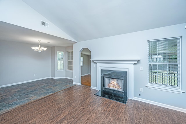 687 Ponderosa Dr, Charleston, SC 29414 - unfurnished living room featuring a chandelier, lofted ceiling, a fireplace with flush hearth, wood finished floors, and arched walkways
