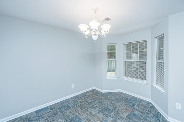 687 Ponderosa Dr, Charleston, SC 29414 - spare room featuring a chandelier and dark stone finish floors