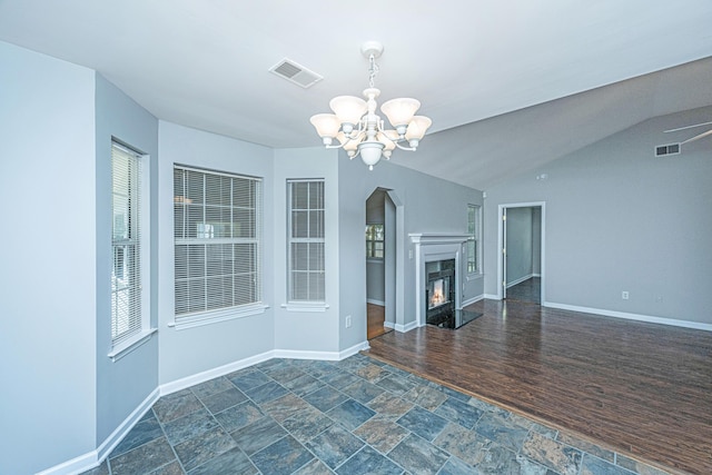 687 Ponderosa Dr, Charleston, SC 29414 - unfurnished living room with a chandelier, stone finish flooring, and a glass covered fireplace