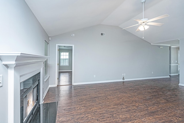 687 Ponderosa Dr, Charleston, SC 29414 - unfurnished living room with lofted ceiling, dark wood-type flooring, a warm lit fireplace, and ceiling fan