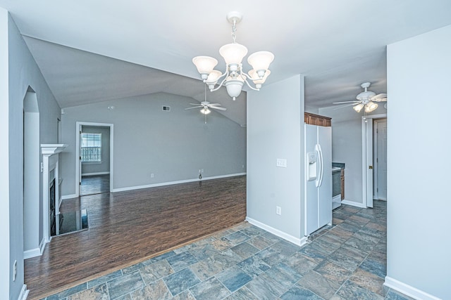 687 Ponderosa Dr, Charleston, SC 29414 - unfurnished living room with a ceiling fan, a fireplace, a chandelier, stone finish flooring, and lofted ceiling
