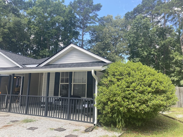 687 Ponderosa Dr, Charleston, SC 29414 - view of home's exterior with a shingled roof and a porch