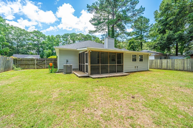 687 Ponderosa Dr, Charleston, SC 29414 - rear view of property with a sunroom, a chimney, and a fenced backyard