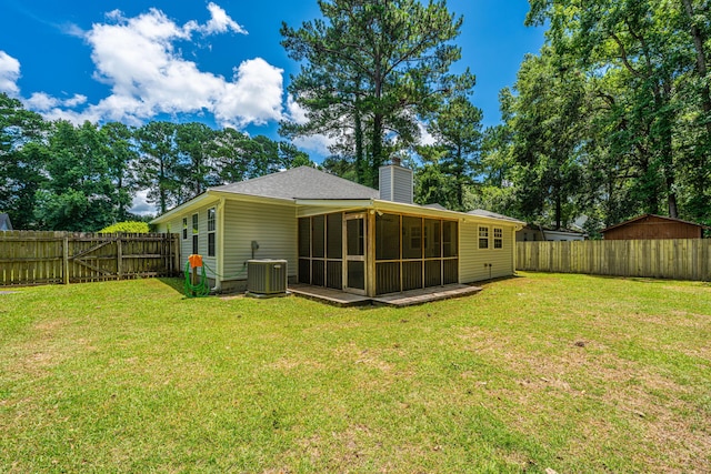 687 Ponderosa Dr, Charleston, SC 29414 - rear view of house featuring a sunroom, a chimney, and a fenced backyard