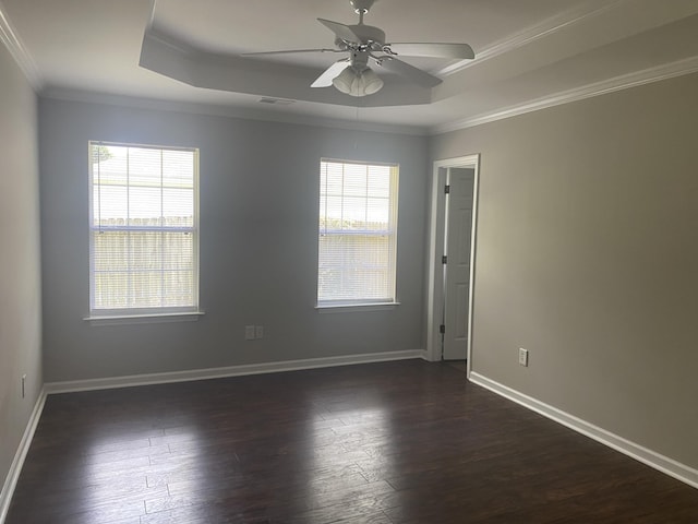 687 Ponderosa Dr, Charleston, SC 29414 - empty room featuring a tray ceiling, plenty of natural light, ornamental molding, ceiling fan, and dark wood-style flooring