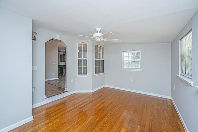 687 Ponderosa Dr, Charleston, SC 29414 - unfurnished room with a ceiling fan, wood finished floors, and arched walkways