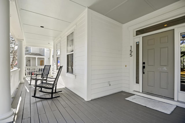 wooden terrace with a porch