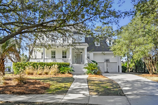 view of front of property with a porch and a garage