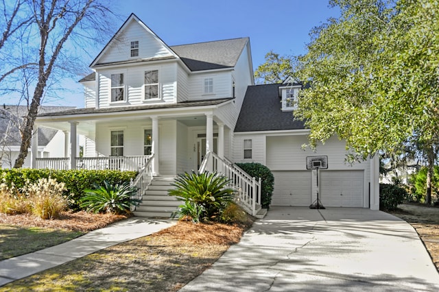 view of front facade featuring covered porch and a garage