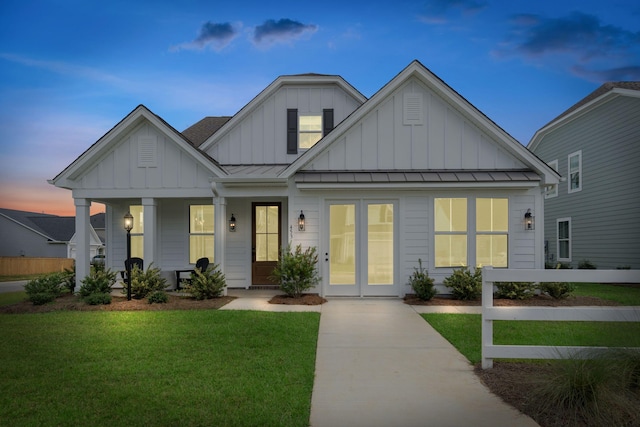 view of front of property featuring a lawn and a porch