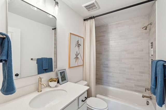 full bathroom featuring toilet, vanity, and shower / bathtub combination with curtain