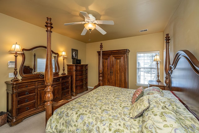 bedroom featuring light carpet, ceiling fan, and visible vents