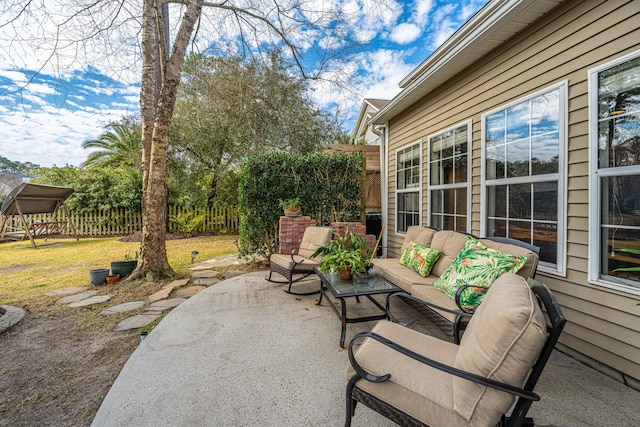 view of patio / terrace with outdoor lounge area and fence