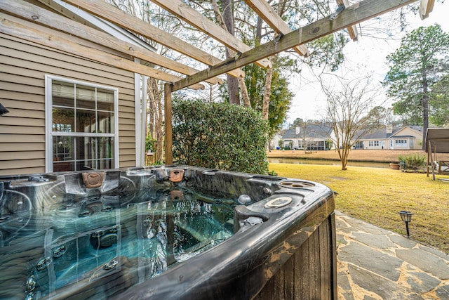 view of patio / terrace with a hot tub