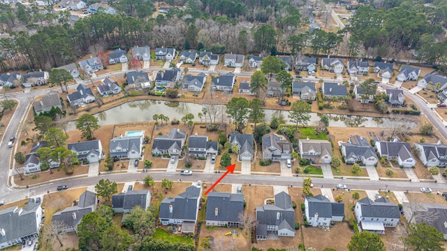 bird's eye view with a water view and a residential view