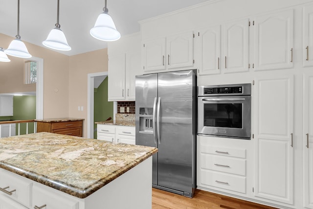 320 Compton Xing, Summerville, SC 29485 - kitchen featuring appliances with stainless steel finishes, light wood-style floors, white cabinets, and decorative backsplash