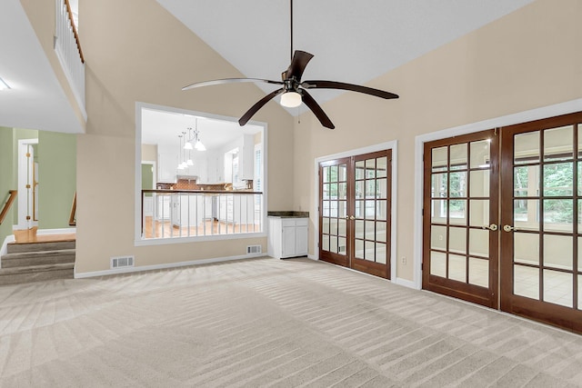 320 Compton Xing, Summerville, SC 29485 - unfurnished living room featuring french doors, carpet floors, a high ceiling, baseboards, and ceiling fan