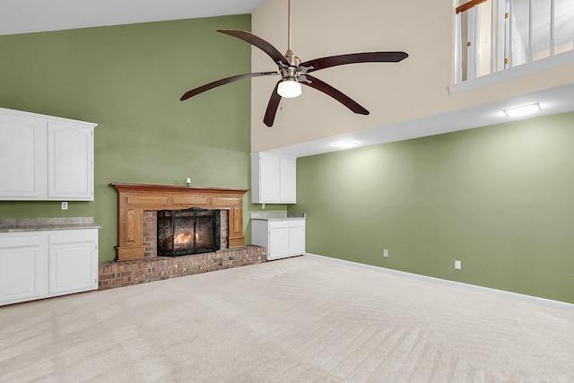 320 Compton Xing, Summerville, SC 29485 - unfurnished living room featuring high vaulted ceiling, a ceiling fan, a brick fireplace, carpet floors, and baseboards