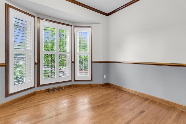320 Compton Xing, Summerville, SC 29485 - empty room with ornamental molding, baseboards, and light wood-type flooring