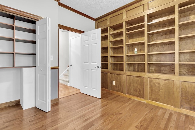 320 Compton Xing, Summerville, SC 29485 - unfurnished bedroom featuring crown molding, wood finished floors, and a textured ceiling