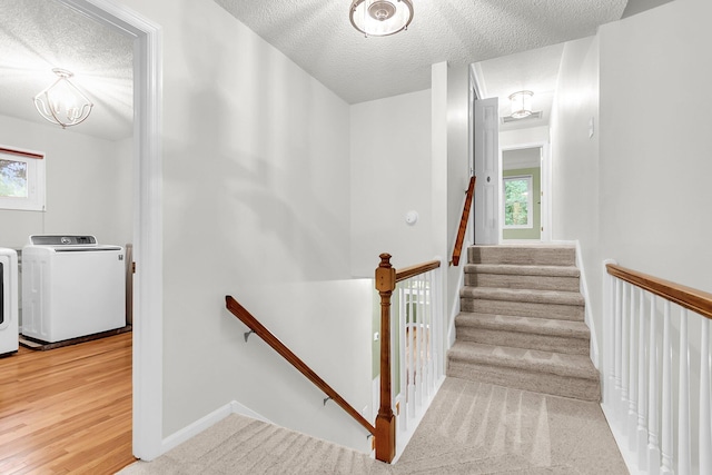 320 Compton Xing, Summerville, SC 29485 - stairway featuring a textured ceiling, independent washer and dryer, plenty of natural light, a chandelier, and baseboards