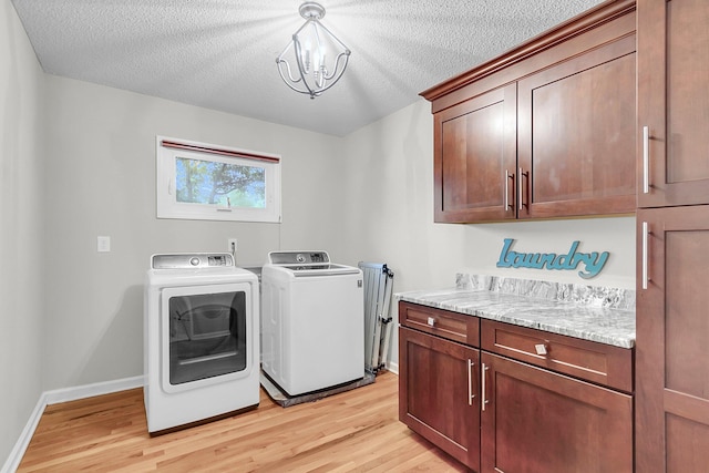 320 Compton Xing, Summerville, SC 29485 - laundry area featuring cabinet space, washing machine and dryer, light wood-type flooring, a textured ceiling, and baseboards