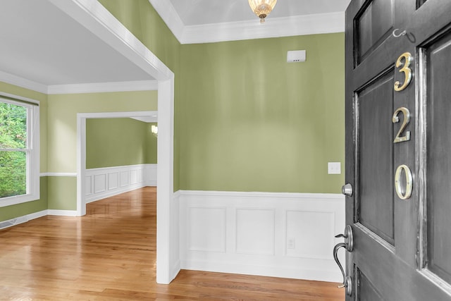 320 Compton Xing, Summerville, SC 29485 - entrance foyer with wainscoting, ornamental molding, and light wood-style flooring