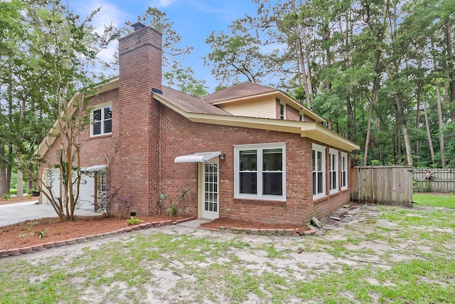 320 Compton Xing, Summerville, SC 29485 - rear view of property featuring a chimney and brick siding