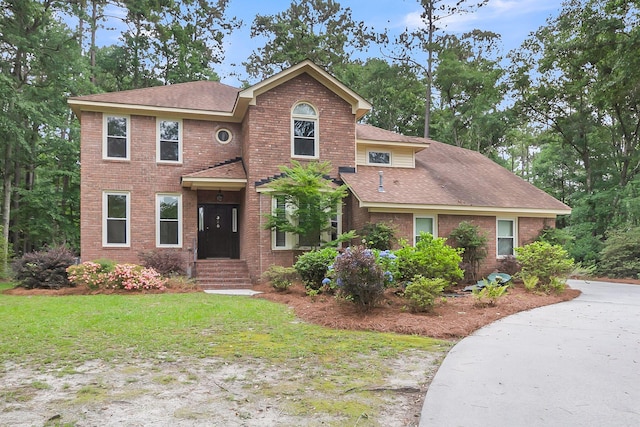 320 Compton Xing, Summerville, SC 29485 - view of front of house with a shingled roof, brick siding, and a front lawn