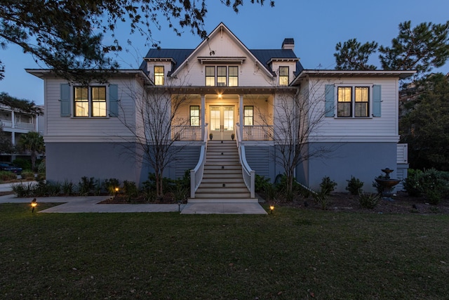2312 Rushland Landing Rd, Johns Island, SC 29455 - view of front of home with stairway, a front lawn, french doors, and covered porch