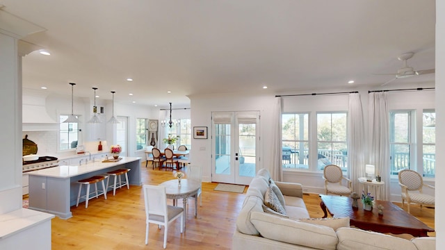 2312 Rushland Landing Rd, Johns Island, SC 29455 - living area featuring light wood-style flooring, ceiling fan, and recessed lighting