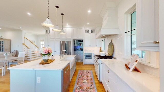 2312 Rushland Landing Rd, Johns Island, SC 29455 - kitchen featuring appliances with stainless steel finishes, a sink, custom exhaust hood, white cabinetry, and recessed lighting