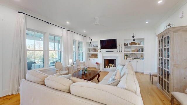 2312 Rushland Landing Rd, Johns Island, SC 29455 - living room with light wood-type flooring, a high end fireplace, built in features, and recessed lighting