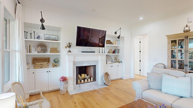 2312 Rushland Landing Rd, Johns Island, SC 29455 - living room with light wood-style floors, a high end fireplace, and crown molding