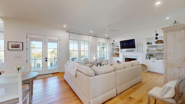 2312 Rushland Landing Rd, Johns Island, SC 29455 - living room with french doors, light wood-style flooring, a fireplace, ceiling fan, and recessed lighting