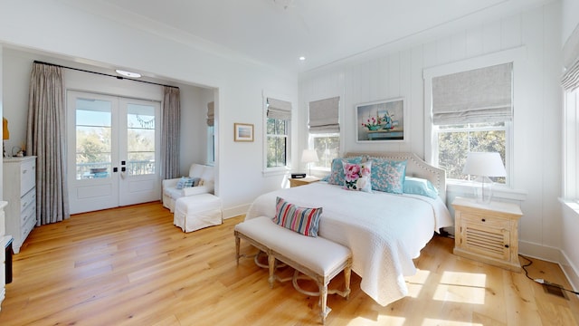 2312 Rushland Landing Rd, Johns Island, SC 29455 - bedroom featuring multiple windows, light wood finished floors, french doors, and access to outside