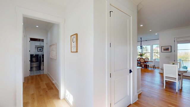 2312 Rushland Landing Rd, Johns Island, SC 29455 - hallway with washer and dryer, light wood-type flooring, recessed lighting, and baseboards