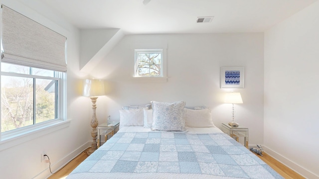 2312 Rushland Landing Rd, Johns Island, SC 29455 - unfurnished bedroom featuring wood finished floors and baseboards