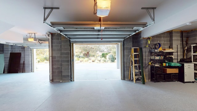 2312 Rushland Landing Rd, Johns Island, SC 29455 - garage featuring a garage door opener and concrete block wall