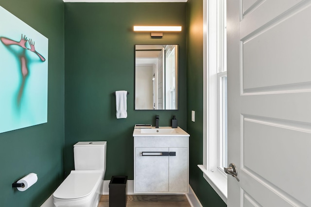 1234 Captain Rivers Dr, Charleston, SC 29412 - half bath featuring toilet, vanity, and wood finished floors