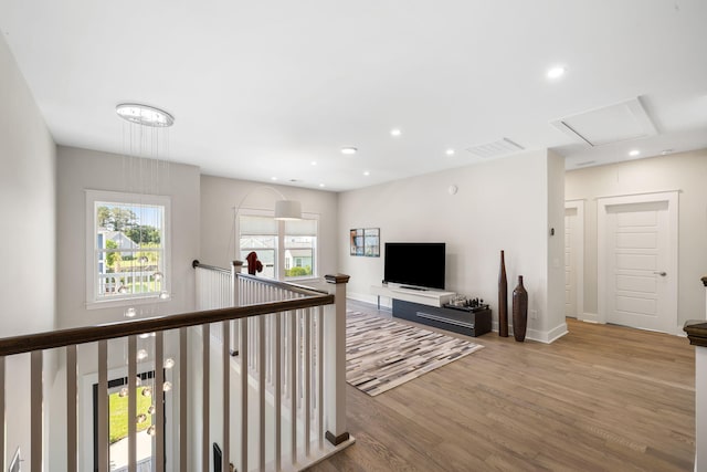1234 Captain Rivers Dr, Charleston, SC 29412 - hallway with an upstairs landing, wood finished floors, attic access, recessed lighting, and baseboards