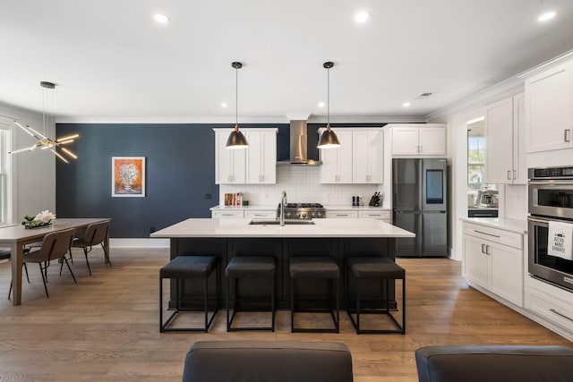 1234 Captain Rivers Dr, Charleston, SC 29412 - kitchen featuring stainless steel appliances, a sink, wall chimney exhaust hood, a breakfast bar, and ornamental molding